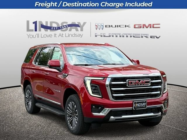 2026 GMC Yukon Elevation in Volcanic Red Tintcoat — front three-quarter view