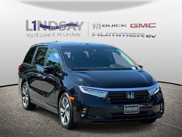 2023 Honda Odyssey Touring in Black — front three-quarter view